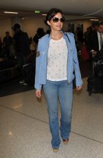 CARLA GUGINO in Jeans at Los Angeles International Airport