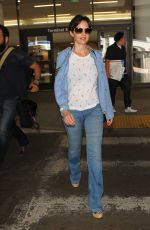 CARLA GUGINO in Jeans at Los Angeles International Airport