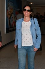 CARLA GUGINO in Jeans at Los Angeles International Airport