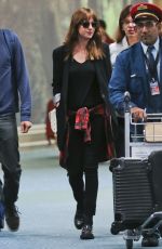 DAKOTA JOHNSON Arrives at Airport in Vancouver