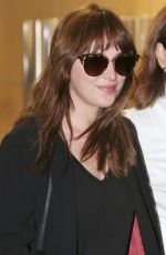 DAKOTA JOHNSON Arrives at Airport in Vancouver