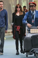 DAKOTA JOHNSON Arrives at Airport in Vancouver