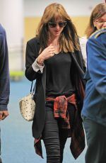 DAKOTA JOHNSON Arrives at Airport in Vancouver