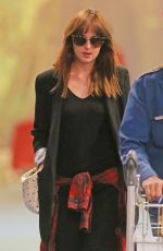 DAKOTA JOHNSON Arrives at Airport in Vancouver