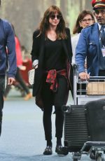 DAKOTA JOHNSON Arrives at Airport in Vancouver