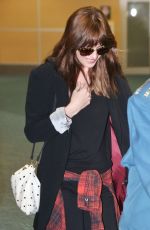 DAKOTA JOHNSON Arrives at Airport in Vancouver