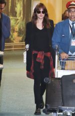 DAKOTA JOHNSON Arrives at Airport in Vancouver