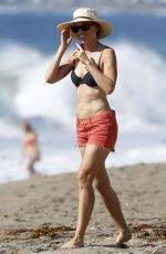 HILARY SWANK in Bikini Top at a Beach in Malibu