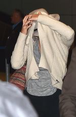 JENNIFER LAWRENCE Hiding from Paps at LAX Airport