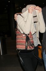 JENNIFER LAWRENCE Hiding from Paps at LAX Airport