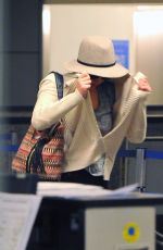 JENNIFER LAWRENCE Hiding from Paps at LAX Airport
