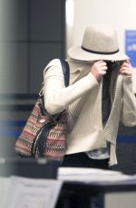 JENNIFER LAWRENCE Hiding from Paps at LAX Airport