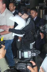 KATY PERRY Hiding Face in pillow at LAX Airport