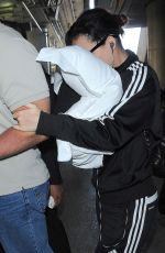 KATY PERRY Hiding Face in pillow at LAX Airport