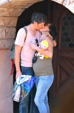 Pregnant MILLA JOVOVICH at Disneyland in Anaheim