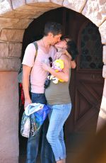 Pregnant MILLA JOVOVICH at Disneyland in Anaheim