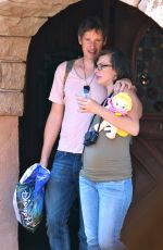 Pregnant MILLA JOVOVICH at Disneyland in Anaheim