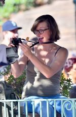 Pregnant MILLA JOVOVICH at Disneyland in Anaheim