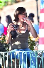 Pregnant MILLA JOVOVICH at Disneyland in Anaheim