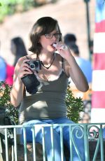 Pregnant MILLA JOVOVICH at Disneyland in Anaheim