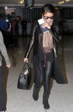 SELENA GOMEZ Arrives at Los Angeles Inernational Airport 2010