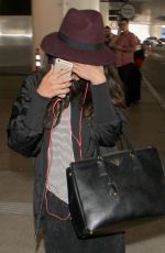 SELENA GOMEZ Hiding from Paps at LAX Airport