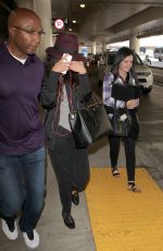 SELENA GOMEZ Hiding from Paps at LAX Airport