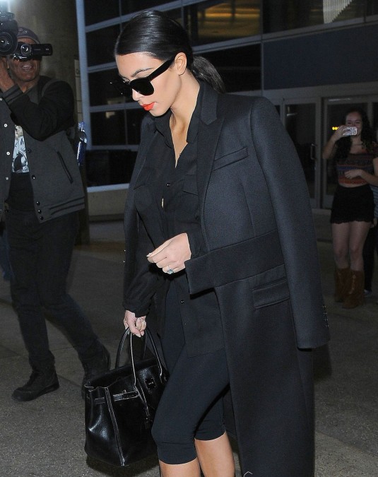 KIM KARDASHIAN Arrives at LAX Airport KIM KARDASHIAN at los Angeles International Airport