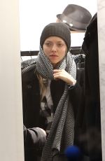 AMANDA SEYFRIED Out Shopping on the Champs-elysées Avenue in Paris