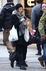 AMANDA SEYFRIED Out Shopping on the Champs-elysées Avenue in Paris