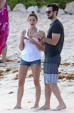 ASHLEY GREENE in Denim Shorts at a Beach in Cancun