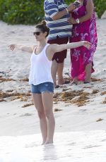 ASHLEY GREENE in Denim Shorts at a Beach in Cancun