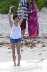 ASHLEY GREENE in Denim Shorts at a Beach in Cancun