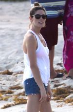 ASHLEY GREENE in Denim Shorts at a Beach in Cancun