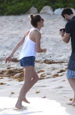 ASHLEY GREENE in Denim Shorts at a Beach in Cancun