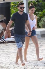 ASHLEY GREENE in Denim Shorts at a Beach in Cancun