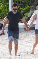 ASHLEY GREENE in Denim Shorts at a Beach in Cancun