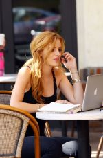 BELLA THORNE Reading a Book at a Cafe in Los Angeles