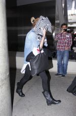 CHARLIZE THERON and Sean Penn Arrives at LAX Airport