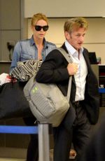 CHARLIZE THERON and Sean Penn Arrives at LAX Airport