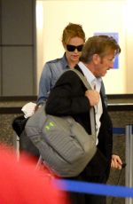 CHARLIZE THERON and Sean Penn Arrives at LAX Airport
