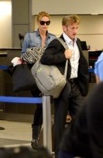 CHARLIZE THERON and Sean Penn Arrives at LAX Airport