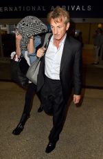 CHARLIZE THERON and Sean Penn Arrives at LAX Airport