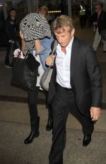 CHARLIZE THERON and Sean Penn Arrives at LAX Airport