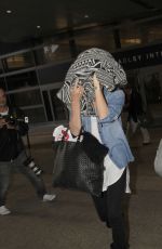 CHARLIZE THERON and Sean Penn Arrives at LAX Airport