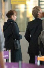 CHARLIZE THERON and Sean Penn Share a Kiss at LAX Airport