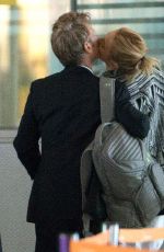 CHARLIZE THERON and Sean Penn Share a Kiss at LAX Airport