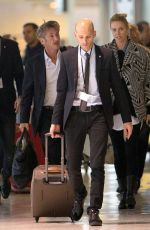 CHARLIZE THERON and Sean Penn Share a Kiss at LAX Airport