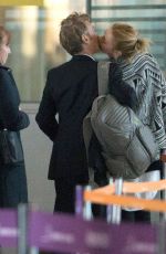 CHARLIZE THERON and Sean Penn Share a Kiss at LAX Airport