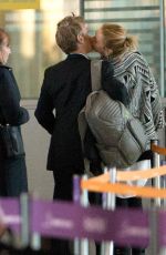 CHARLIZE THERON and Sean Penn Share a Kiss at LAX Airport